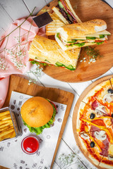 delicious lunch, pizza, hamburger, sandwich and french fries