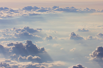 Background blue sky with a cloud behind the airplane window