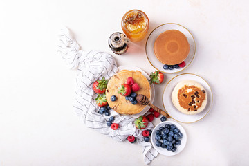 Blueberry pancakes served with honey