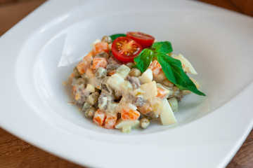 European international fusion cuisine, a beautiful dish on a white plate decorated with herbs and...
