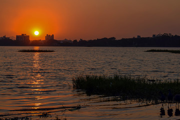 Sunset capture on the beach of a river situated in the old city of India