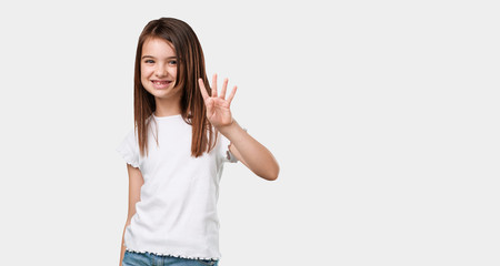 Full body little girl showing the number four, symbol of counting, concept of mathematics, confident and cheerful