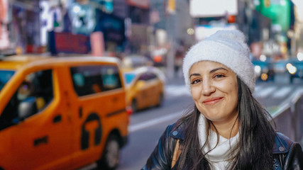 Young beautiful woman in the streets of New York for sightseeing