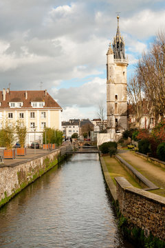 River Iton running through Evreux, Normandy, with medieval Belfry built in XV century, France