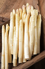 white asparagus on old table