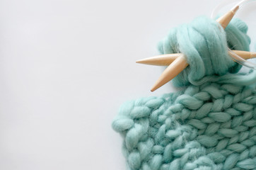 knitting wool yarn turquoise on a light background