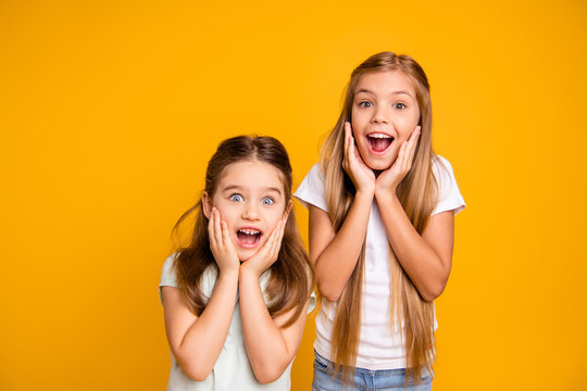 Portrait of two nice crazy adorable winsome sweet attractive lovely pretty cheerful cheery straight-haired girls omg facial expression isolated over bright vivid shine yellow background