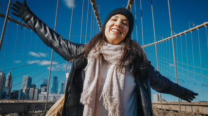 Happy girl in New York enjoy the beautiful Brooklyn Bridge