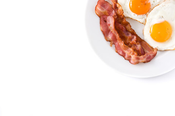 Fried eggs and bacon for breakfast isolated on white background.Top view. Copyspace