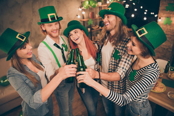 Irish national tradition holiday festive st paddy day five members company in decorated flat room...