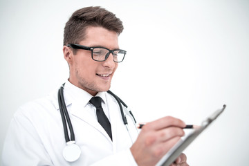 close up.smiling doctor writing a prescription.