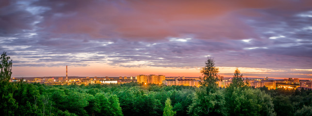 a panorama view of the city of Tallinn with a pink sky. 
