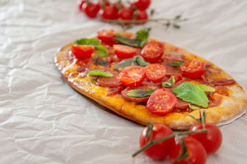 Sausage Pizza with Ham and tomatoes
