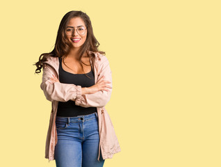 Full body young curvy woman crossing arms, smiling and relaxed