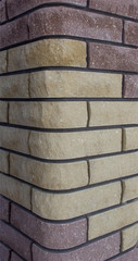 Modern brick column with brown and gray bricks, designer, texture, background, close-up, abstract