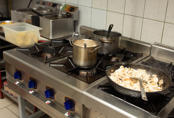 Oily and dirty gas stove in the kitchen at the restaurant catering, anti-sanitary, unsanitary conditions