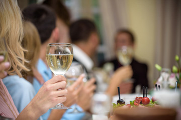 Celebration. People holding glasses of champagne making a toast