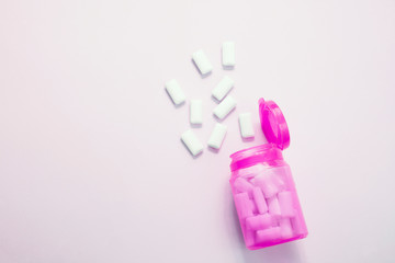 İsolated pink bottle gum on pink background