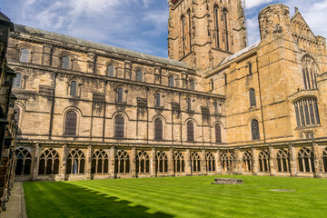 Fototapeta premium courtyard of a medieval cathedral, with a tower and walls. 