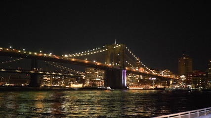 Fototapeta na wymiar Wonderful place in New York at night the illuminated Brooklyn Bridge