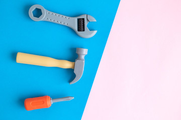 Flat lay of plastic hand tools abstract on colorful background.