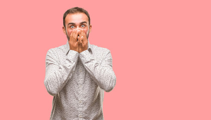 Caucasian man on grey brackground very scared and afraid hidden