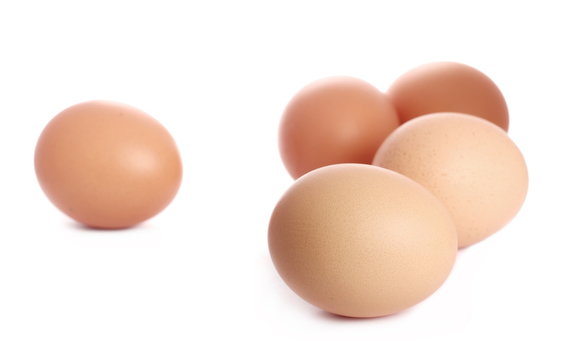 Fresh hen eggs isolated on white background