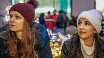 Two girls enjoy the wonderful Christmas time in New York
