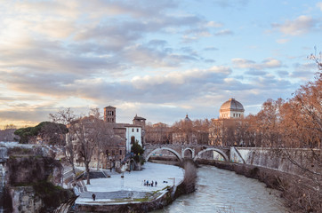 a view of the Tiber River at sunset in Rome