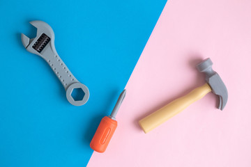 Top view of plastic hand tools abstract on colorful background.