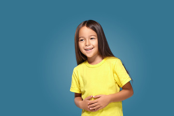 Little girl in yellow t-shirt is smiling