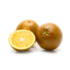 Dark orange isolated on white background. Brown oranges on white.
