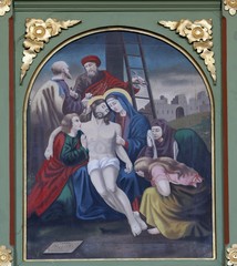 Fototapeta na wymiar 13th Stations of the Cross,Jesus' body is removed from the cross, church of Saint Matthew in Stitar, Croatia