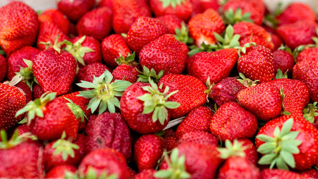 Fresh strawberries on the market. Background concept - image