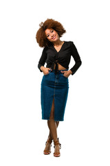 full body afro woman standing with hands on her hips