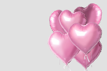 Fototapeta na wymiar Bunch of pink color heart shaped foil balloons isolated on bright background. Minimal love concept.