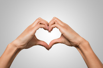 Fototapeta premium hands doing a heart symbol