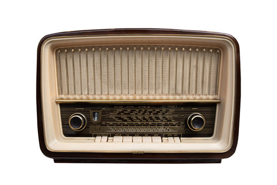 Photo of a brown vintage radio with wooden casing isolated on white