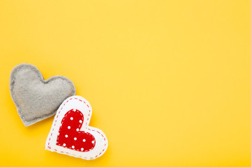 Fabric hearts on yellow background