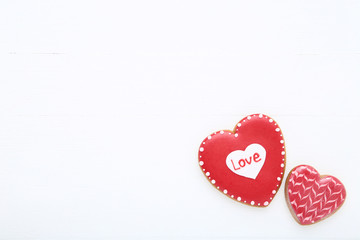 Valentine day heart shaped cookies on white wooden table