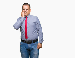 Middle age arab man wearing red tie over isolated background looking stressed and nervous with hands on mouth biting nails. Anxiety problem.