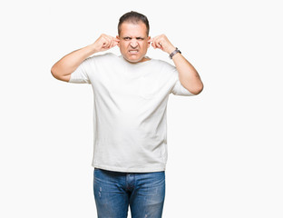 Middle age arab man wearig white t-shirt over isolated background Smiling pulling ears with fingers, funny gesture. Audition problem