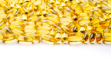 Omega-3 fish fat oil capsules on a white background.