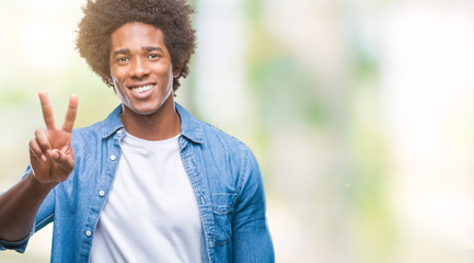 Afro american man over isolated background showing and pointing up with fingers number two while smiling confident and happy.