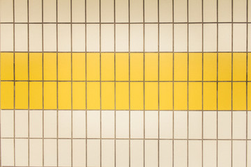 Yellow and white tiles in a subway station in Düsseldorf, Germany - 247423189