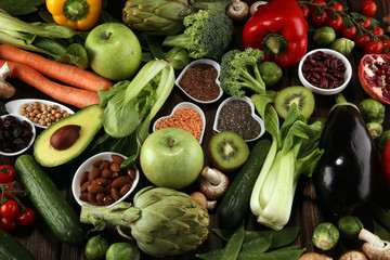 Healthy food clean eating selection. fruit, vegetable, seeds, superfood, cereals, leaf vegetable on...