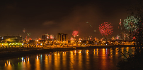 urban landscape salutes in honor of the new year near the river Kuban