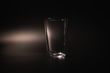 On a black background in a glass of water poured