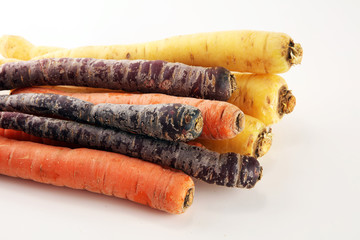 pile of carrots. Crate of mixed fresh harvested colorful carrot.