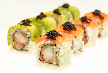 Japanese cuisine. Salmon sushi roll with rise isolated on white